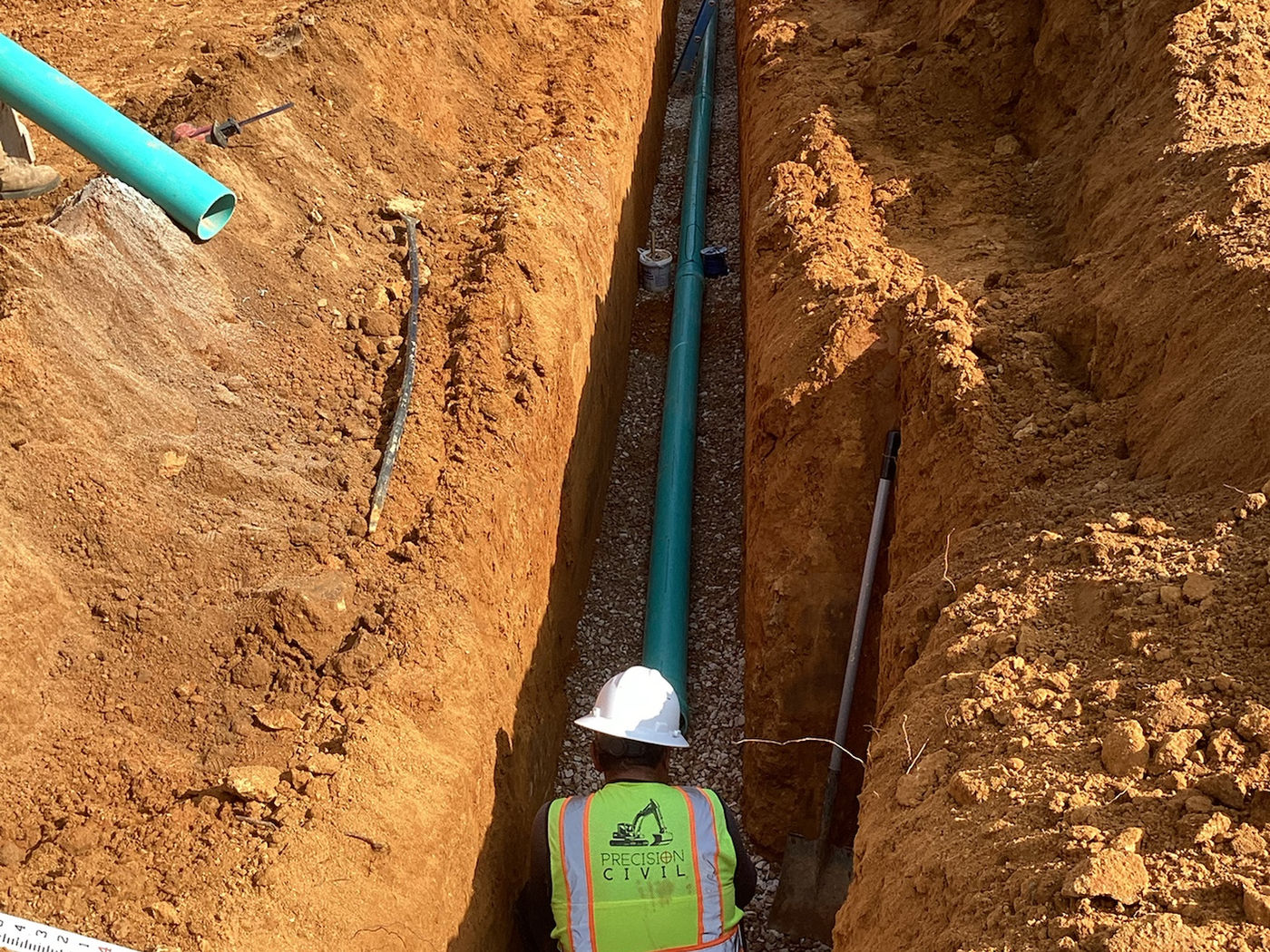 Installed pipe in narrow trench